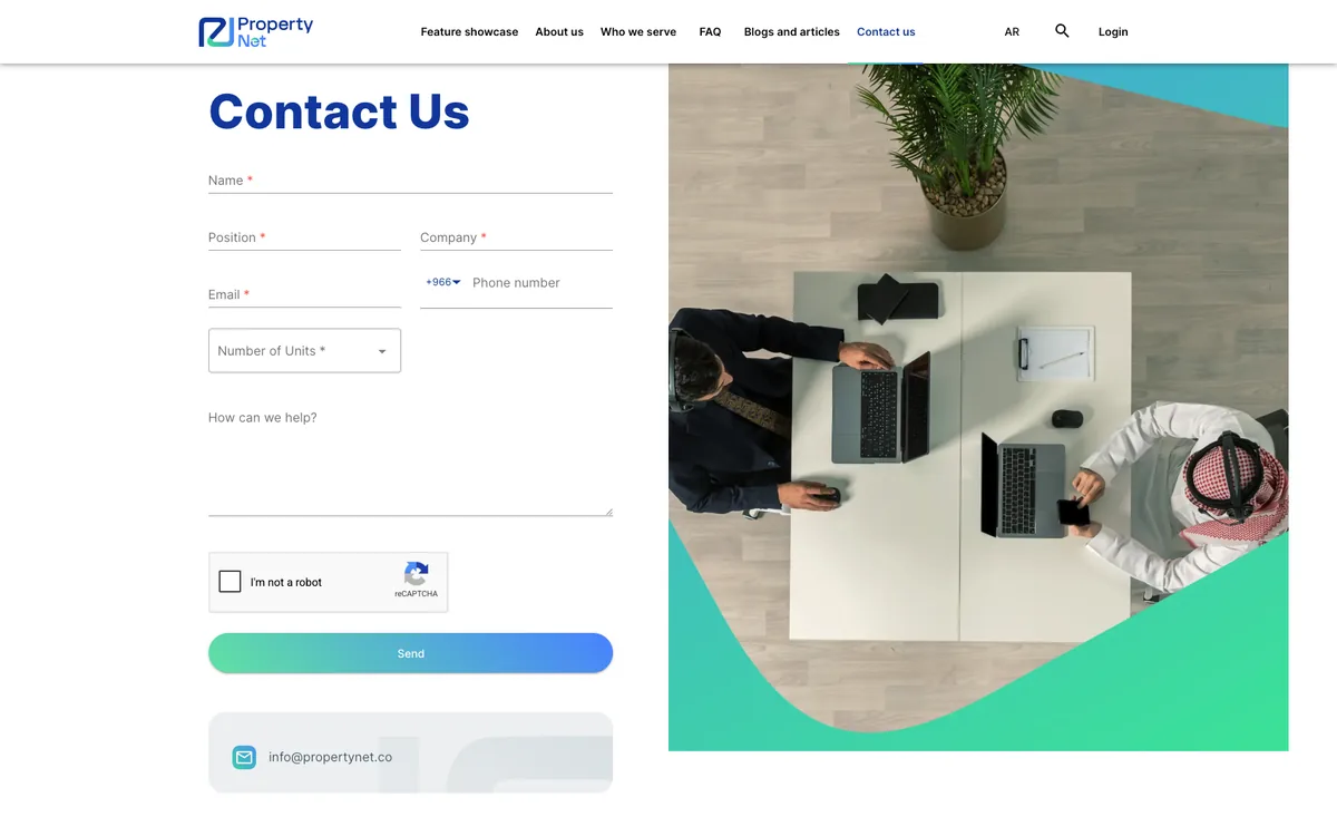 PropertyNet contact page: the enquiry form beside an overhead photograph of a meeting